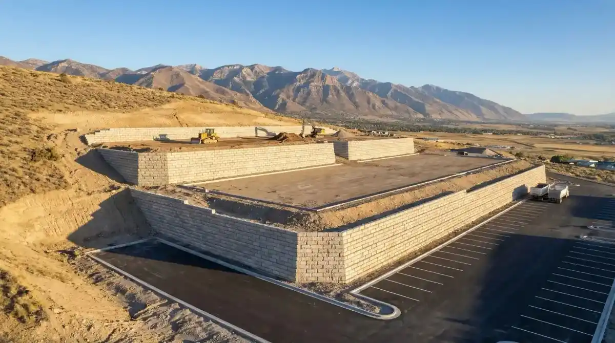 Aerial view of commercial site with multiple retaining wall terraces
